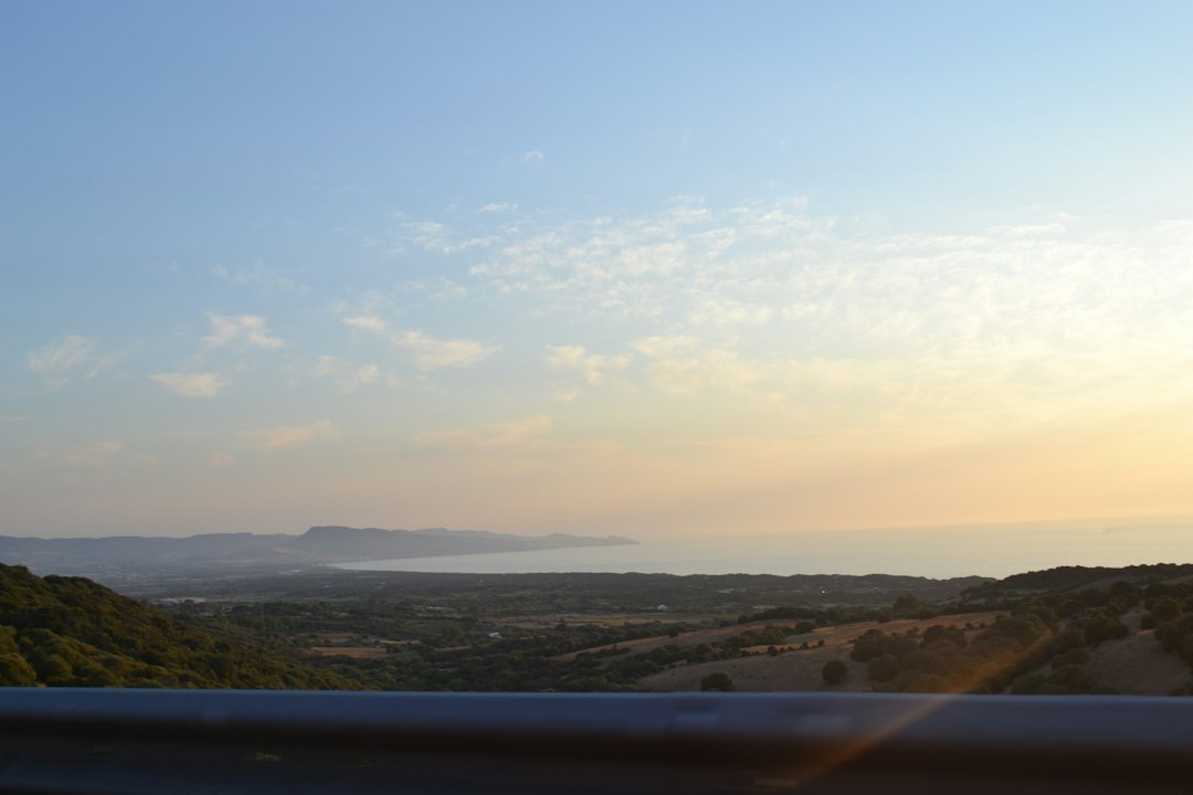 Hills overlooking the ocean at sunset